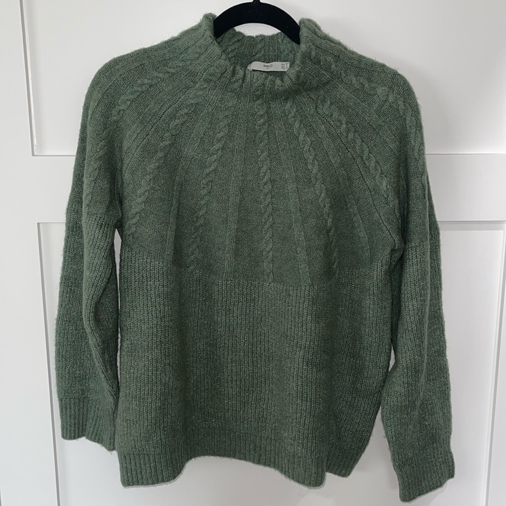 Women’s sweater with cable knit detail
